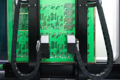Electrical test probe checking PCB for opens and shorts